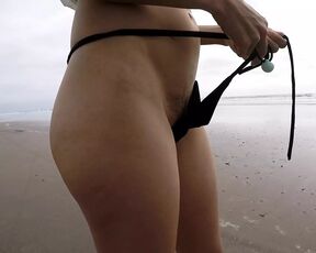 Walking on the beach micro bikini flash hairy pussy